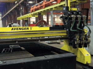 An ESOP plasma cutter/flame table from JTV Manufacturing is pictured as part of a warehouse.